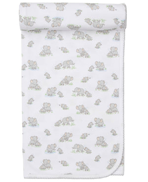 The Kissy Kissy Elephant Esprit Printed Blanket is made from soft Pima cotton, featuring gray cartoon elephants and green grass, with a neatly rolled top edge.