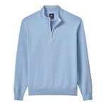 The Johnnie-O Desmond Quarter Zip is a light blue long-sleeve pullover with ribbed hem and cuffs, a half-zip front, stand collar, and cotton-heavy blend, shown laid flat on a white background.