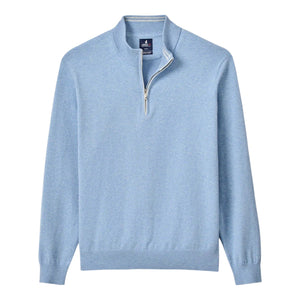 The Johnnie-O Desmond Quarter Zip is a light blue long-sleeve pullover with ribbed hem and cuffs, a half-zip front, stand collar, and cotton-heavy blend, shown laid flat on a white background.