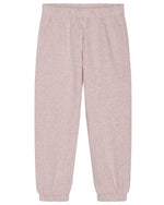 Girls’ Sweat Pants by Serendipity, shown in light pink with a loose fit, featuring an elastic waistband and cuffs, are laid flat against a white background. Made from organic cotton and GOTS certified, these sweatpants combine comfort with sustainable style.