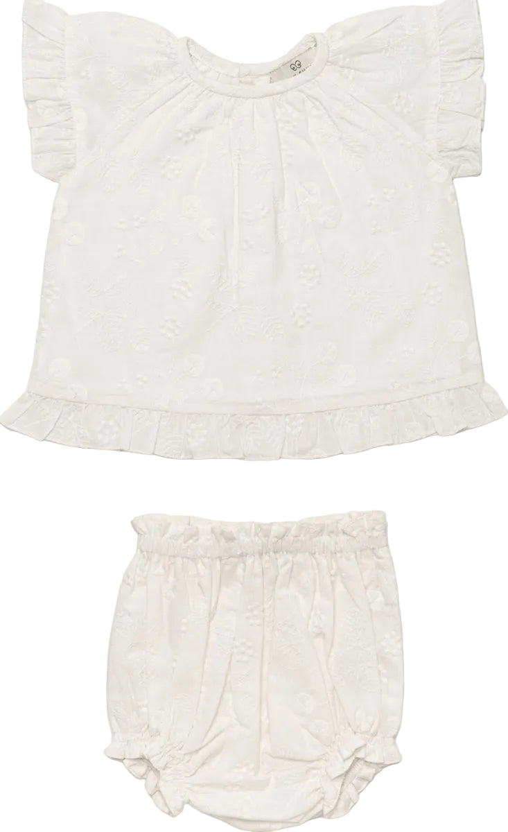 Early Sunday Baby Girls’ Kitty Baby Blouse & Bloomer set in white, featuring a short-sleeve ruffled blouse and matching elastic-waist bloomer, both made from 100% cotton with subtle floral patterns, displayed flat on a white background.