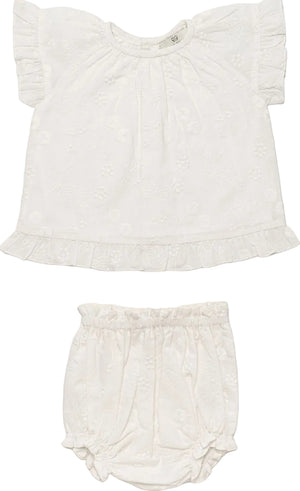 Early Sunday Baby Girls’ Kitty Baby Blouse & Bloomer set in white, featuring a short-sleeve ruffled blouse and matching elastic-waist bloomer, both made from 100% cotton with subtle floral patterns, displayed flat on a white background.