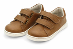 The Boys' Kyle Double Strap Sneaker by L'Amour Shoes is a brown children's shoe with white soles, two Velcro straps per shoe, and a supportive leather sockbed, shown against a white background.