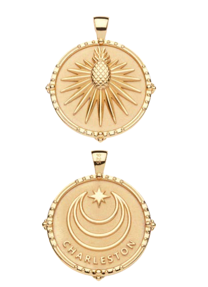 From the Jane Win Destination Pendant Necklace Collection: one necklace features a radiating pineapple, while the other displays crescent moons, a star, and "Charleston.