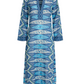 Emporio Sirenuse Jenna Kites Caftan Dress—long-sleeved blue and white patterned caftan featuring a deep V-neckline and geometric detailing on the neckline, cuffs, and bodice.