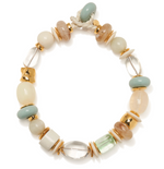 The Monument Collar by Lizzie Fortunato features assorted round and oval beads in pastel watercolor hues, highlighted with gold accents and finished with a rope knot clasp.
