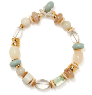 The Monument Collar by Lizzie Fortunato features assorted round and oval beads in pastel watercolor hues, highlighted with gold accents and finished with a rope knot clasp.