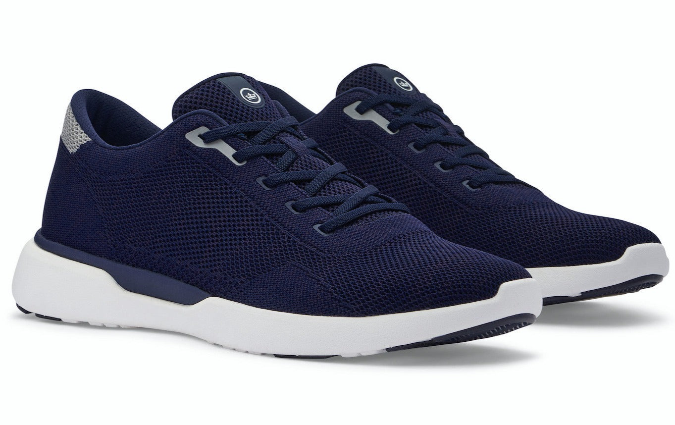 A pair of navy blue Peter Millar Glide V3 athletic sneakers with lightweight outsoles.