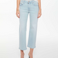 A person wears Mother’s Mid Rise Rambler Zip Ankle Fray jeans in light blue denim, paired with a white sleeveless top and open-toe high heels, standing against a white background.