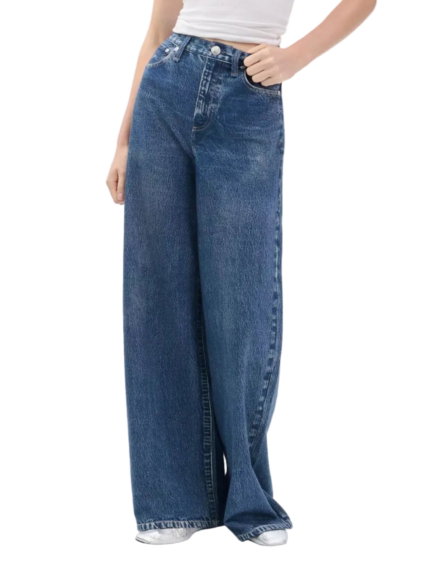 Model wears the Rag & Bone Miramar Terry Sofie Full: wide-leg blue sweatpant jeans with a high waist and relaxed Sofie fit, styled with a white sleeveless top. These jeans offer classic denim style combined with the comfort of sweats.