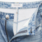 Close-up of light blue Miramar Terry Sofie Wide Pant by Rag & Bone, high-rise style with zipper open, revealing white pocket lining and Rag & Bone label on waistband.
