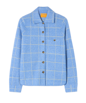 The Dylan Plaid Shirt by Guest in Residence is a light blue, western-style button-up with a white grid pattern, brown buttons, and a single chest pocket. Made from a cashmere-linen blend, it's shown on a plain white background.