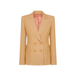 The Renegade Charmer Blazer by Blaze Milano is a beige women's double-breasted linen blazer with gold buttons and a notched lapel, designed for a polished hourglass silhouette, shown on a white background.