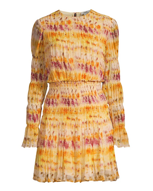 The Jason Wu Printed Silk Crinkle Chiffon Dress features long sleeves, a mini length, a pleated design, and a yellow-orange-pink tie-dye pattern with a fitted smocked waist and cuffs.