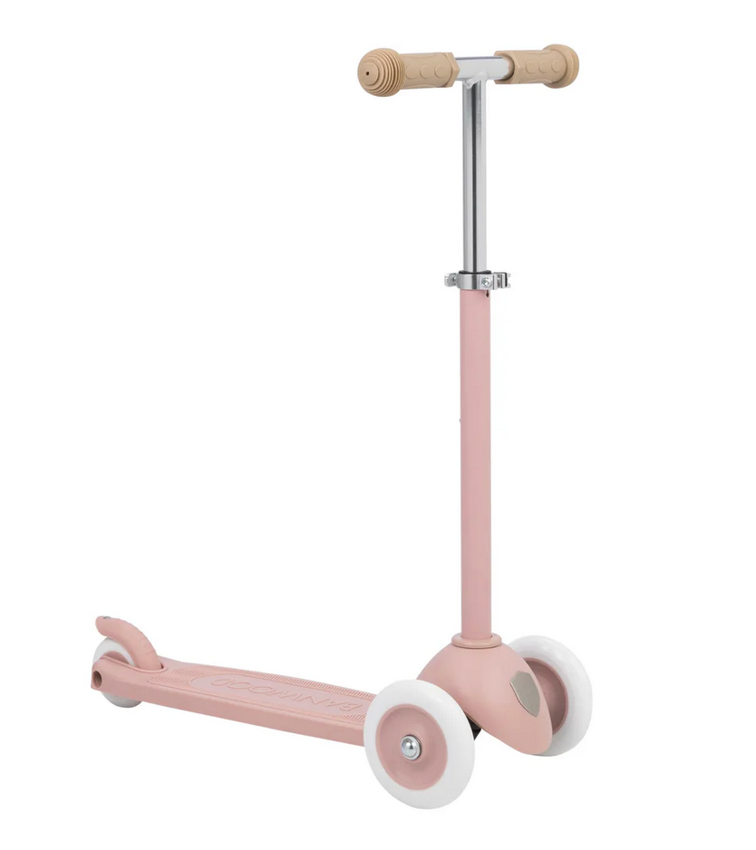 The Banwood Eco Scooter is a pink 3-wheel scooter from the Eco Collection, featuring beige handles and white recycled plastic wheels, shown on a plain white background.