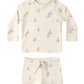The Rylee & Cru Baby Boys' Rashguard Set features long sleeves in off-white with blue and orange sailboat prints. This UPF 50+ swimwear offers stylish sun protection for all your child’s water adventures.