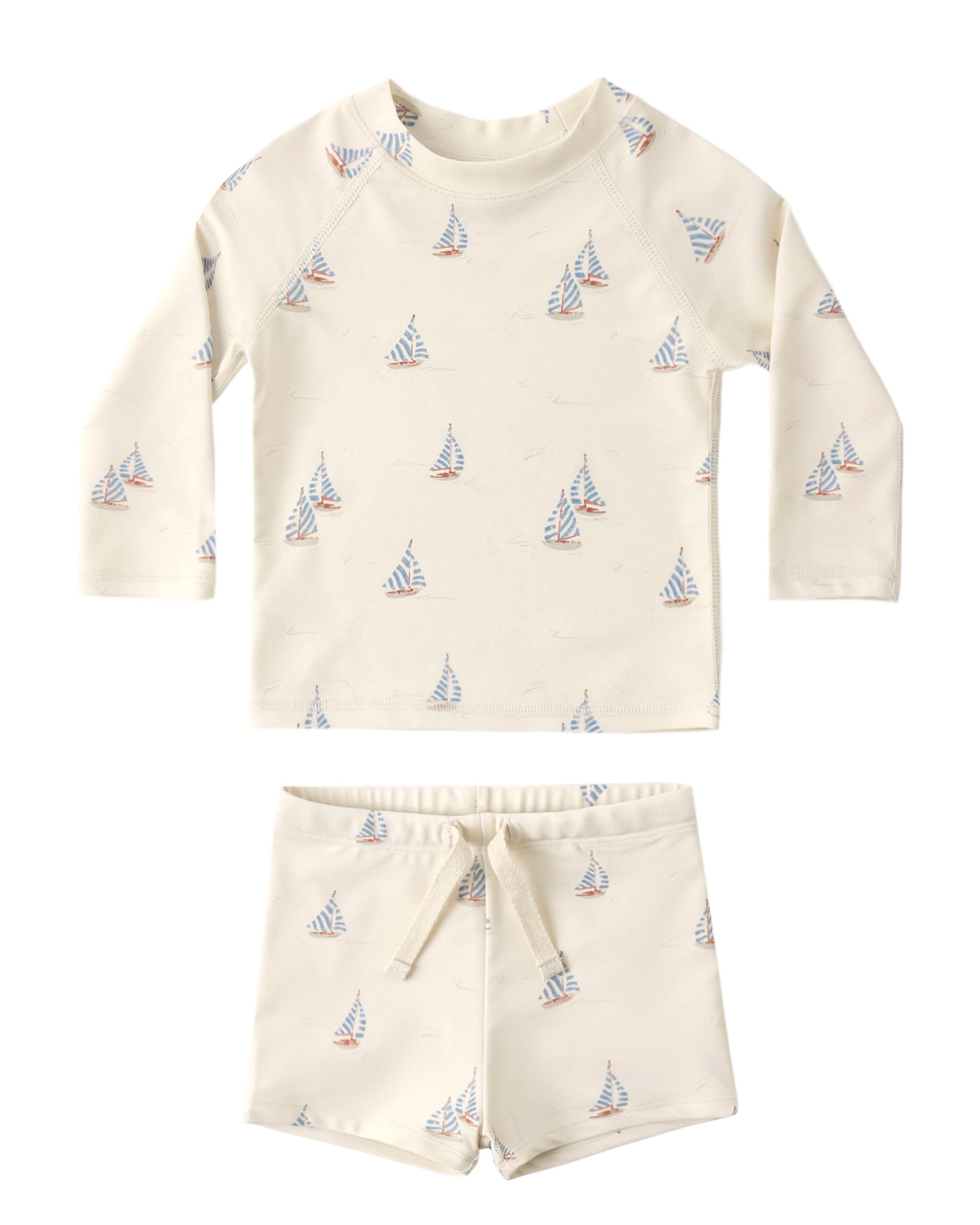 The Rylee & Cru Baby Boys' Rashguard Set features long sleeves in off-white with blue and orange sailboat prints. This UPF 50+ swimwear offers stylish sun protection for all your child’s water adventures.
