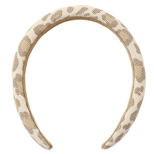 The Girls’ Padded Headband by Rylee & Cru features a beige base with a brown animal print pattern, offering both style and comfort; it is pictured from above against a white background.