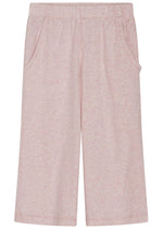 The Serendipity Girls’ Rib Loose Pants are light pink, wide-leg children’s pants with an elastic waist and side pockets, crafted from GOTS certified organic cotton rib. They are displayed flat against a white background.