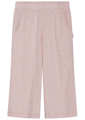 The Serendipity Girls’ Rib Loose Pants are light pink, wide-leg children’s pants with an elastic waist and side pockets, crafted from GOTS certified organic cotton rib. They are displayed flat against a white background.