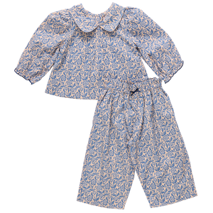 The Pink Chicken Baby Girls' Dawson 2-Piece Set features a blue climbing floral print on soft cotton poplin, with a long-sleeve top with Peter Pan collar and matching loose-fit pants for cozy comfort.
