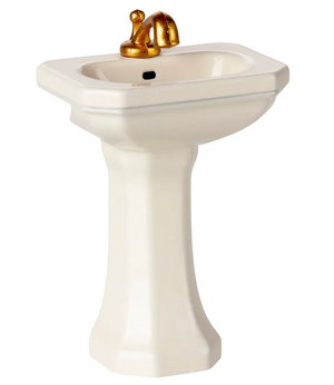 An Off White Bathroom Sink - Mouse by Maileg, featuring a gold faucet and perfect for the SuitCasa Mouse House or Little Brother and Little Sister Mouse, is displayed against a plain background.