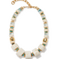 The Granada Necklace by Lizzie Fortunato features large white square beads, gold spacers, and small round white and Arizona turquoise beads, finished with a gold chain and clasp.