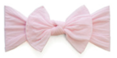 The Baby Bling Classic Knot Headband by Baby Bling is crafted from high-quality material and comes in a pink fabric with a textured finish, showcasing symmetrical loops tied into a perfect knot.