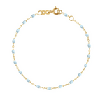 Introducing the Gigi Clozeau Little Gigi Classic Bracelet 5.1", a delicate 18K gold chain with light blue bead accents and a secure clasp.