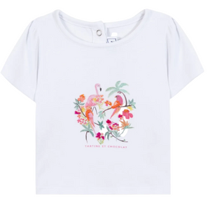 The Baby Girls’ and Girls’ Tropical T-shirt by Tartine et Chocolat is a white short-sleeve cotton tee adorned with a tropical print, embroidered flamingo, vibrant flowers, palm trees, and “Tartine et Chocolat” text on the front—ideal for a breezy summer look.
