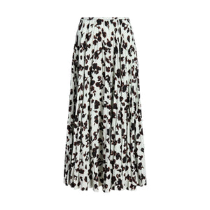 The Runa Skirt by Proenza Schouler White Label is a pleated A-line skirt with a black floral pattern on white, adding elegance to any wardrobe.
