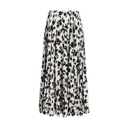 The Runa Skirt by Proenza Schouler White Label is a pleated A-line skirt with a black floral pattern on white, adding elegance to any wardrobe.