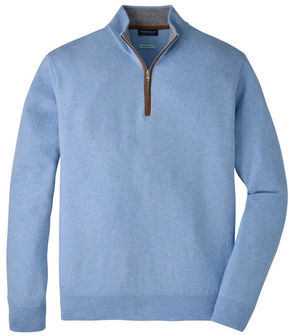 The Peter Millar Artisan Crafted Cashmere Flex Quarter-Zip in light blue features a brown zipper and stand-up collar, displayed on a white background—an elevated piece inspired by the refined tradition of Italian cashmere sweaters.