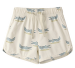 Rylee & Cru Baby Boys' and Boys' Swim Trunk: beige elastic drawstring swim trunks with mesh liner, cartoon blue crocodile pattern, and UPF 50+ sun protection.