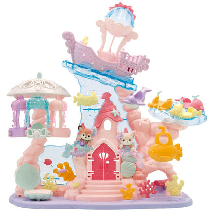 Discover the Calico Critters Baby Mermaid Castle, a colorful plastic playset with an undersea theme. It features adorable animal figures, a magical mermaid castle, sea creatures, a submarine, and a shipwreck in vibrant shades of pink, purple, blue, and yellow.
