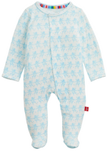 The Magnetic Me Baby Trunkettes Footie features a light blue color with a subtle animal print and a multicolored neckline trim, shown on a white background.