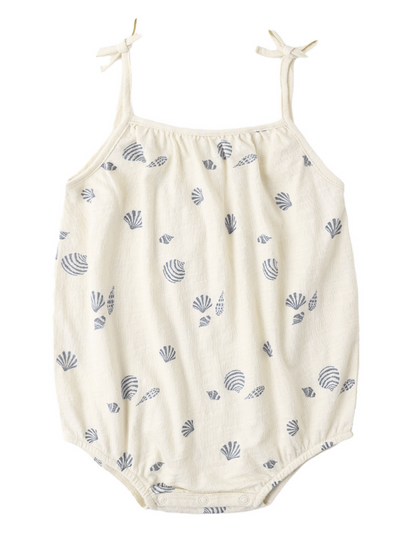 The Baby Girls' Nala Romper by Rylee & Cru features bow straps and blue seashells on soft white cotton jersey, with snaps at the bottom for easy changing.