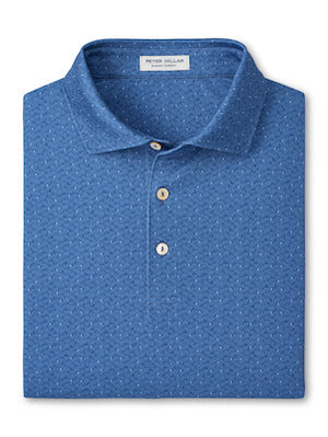 The Peter Millar Negroni Performance Jersey Polo is a folded blue shirt featuring a subtle dotted pattern, three beige buttons, and four-way stretch for ease of movement.