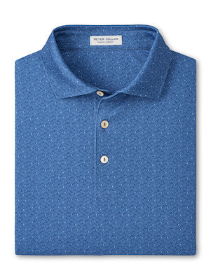 The Peter Millar Negroni Performance Jersey Polo is a folded blue shirt featuring a subtle dotted pattern, three beige buttons, and four-way stretch for ease of movement.