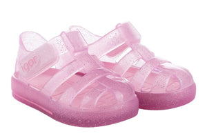 The Igor Girls' Star Jelly Sandal features translucent pink PVC with glitter, closed toes, side straps, and a removable foot bed.
