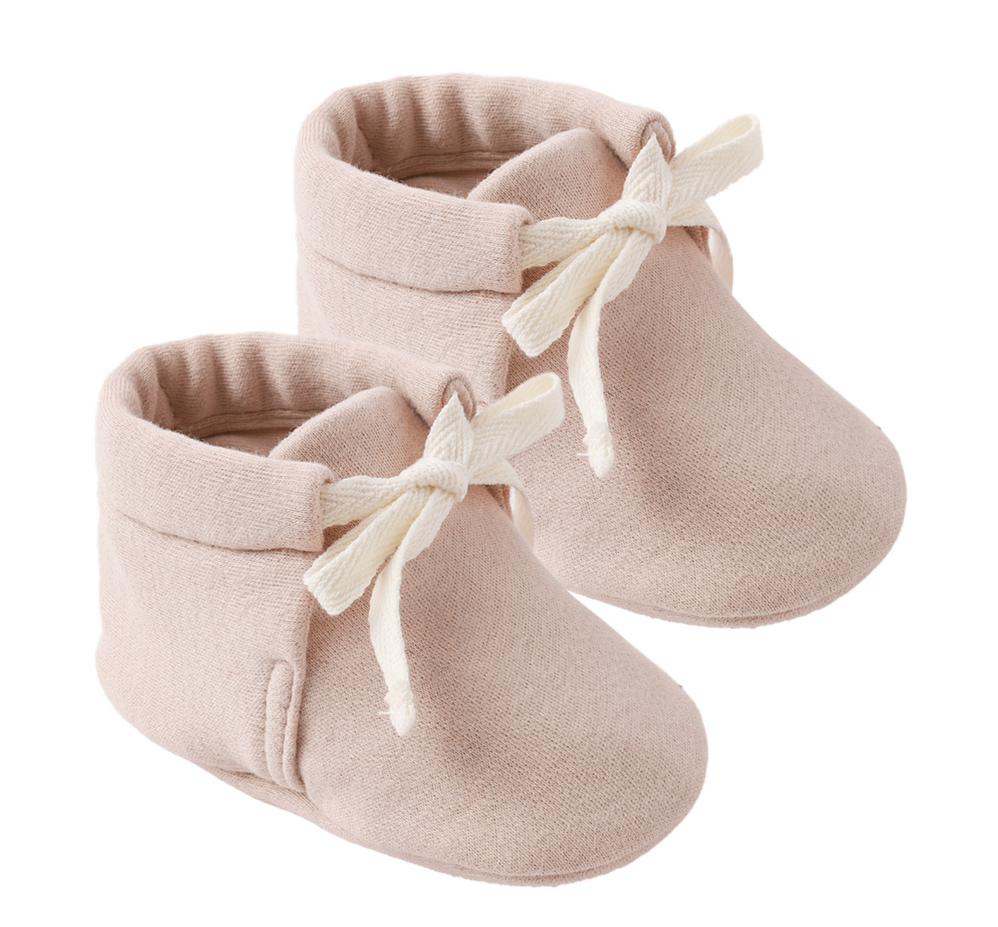 A pair of Quincy Mae Baby Booties in a soft light pink color, featuring cream-colored fabric bows and crafted for a comfortable fit, shown against a white background.