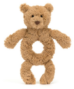 A Jellycat Bartholomew Bear Ring Rattle with a circular opening in the middle, designed with soft, brown fur and black eyes, made from recycled fibers to ensure eco-friendliness and crafted according to safety recommendations for newborns.