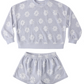 The Baby Girls' and Girls' Karli Set by Rylee & Cru is a light purple terry cloth loungewear set with a long-sleeve top and shorts, featuring a white floral pattern—ideal for relaxed summer days.