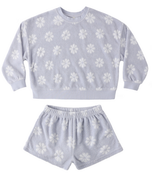 The Baby Girls' and Girls' Karli Set by Rylee & Cru is a light purple terry cloth loungewear set with a long-sleeve top and shorts, featuring a white floral pattern—ideal for relaxed summer days.