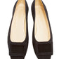 A pair of Ann Mashburn Suede Buckle Shoes in black calf suede with square toes and chic rectangular accents, featuring a subtle top buckle, viewed from above.