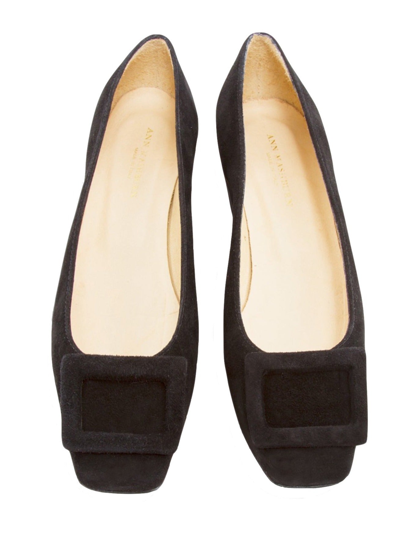 A pair of Ann Mashburn black calf suede women's flat shoes with square toes and decorative bows, isolated on a white background.