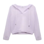 The Modern Statements Pullover by Dorothee Schumacher is a light purple Merino-cashmere hooded top with long sleeves, a V-neck, and drawstrings, shown on a plain background.