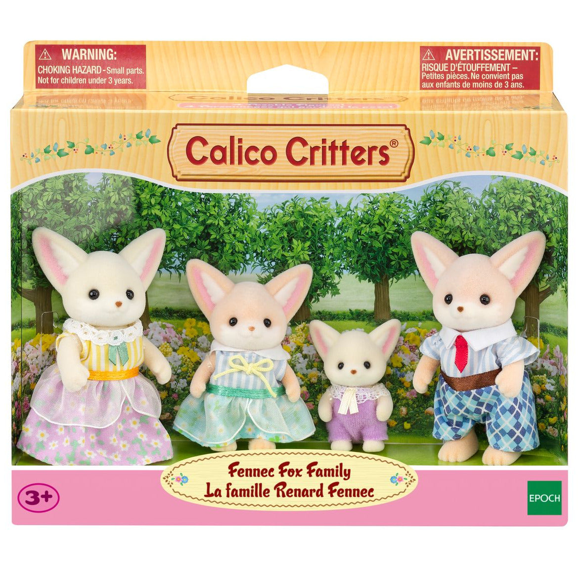 The Calico Critters Fennec Fox Family set includes two adult and two child fox figures dressed in colorful, removable soft fabric outfits, all presented against a charming garden background.