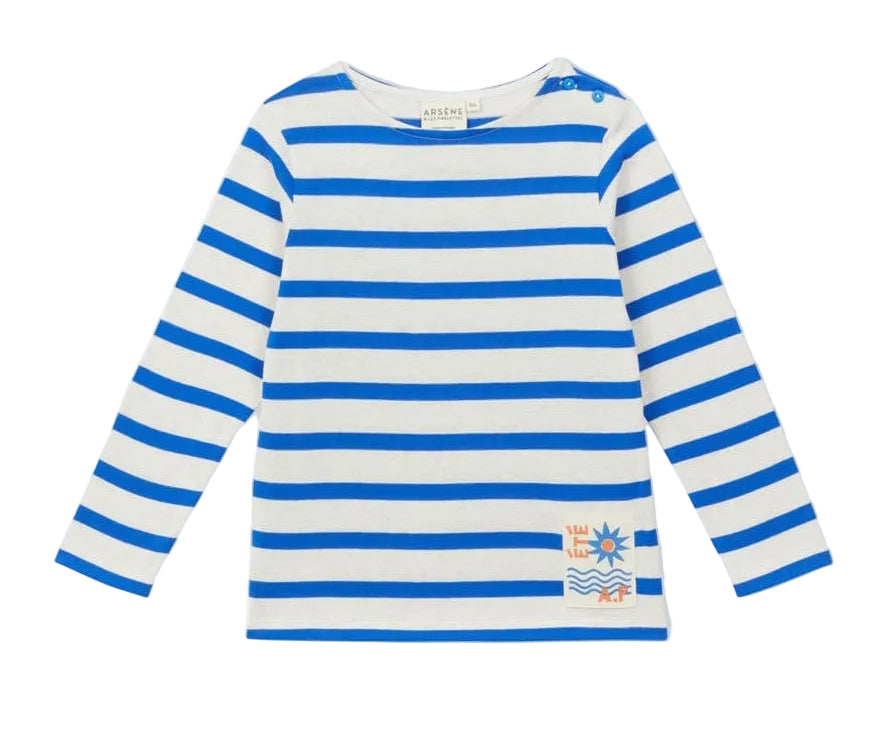 Nautical-inspired and stylish, the Arsene & Les Pipelettes Boys' and Girls' Sailor Shirt features blue and white horizontal stripes, charming blue shoulder buttons, and a small patch with an orange sun and waves design near the hem.