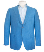 A Samuelsohn Bennet Contemporary Fit Blazer with a checkered dress shirt underneath, showcased on a mannequin, exemplifies hand-tailored production.